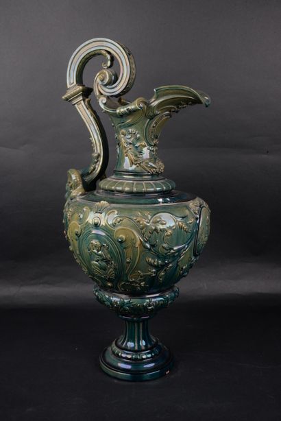 null Important decorative ewer in glazed ceramic, the handle ending with a head of...