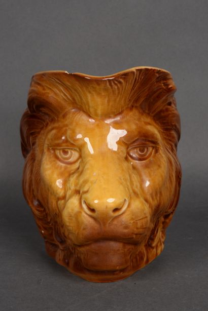null SARREGUEMINES, Glazed earthenware pitcher forming a lion's head, XIX period,...