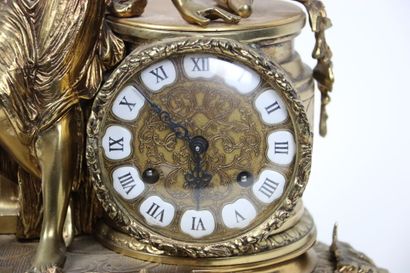 null In the Louis XVI style. Clock in gilt bronze decorated with a woman in the antique...