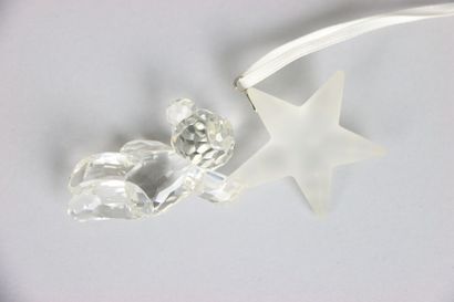 null SWAROVSKY. Crystal subject to hang on the tree including a sleigh and a star...