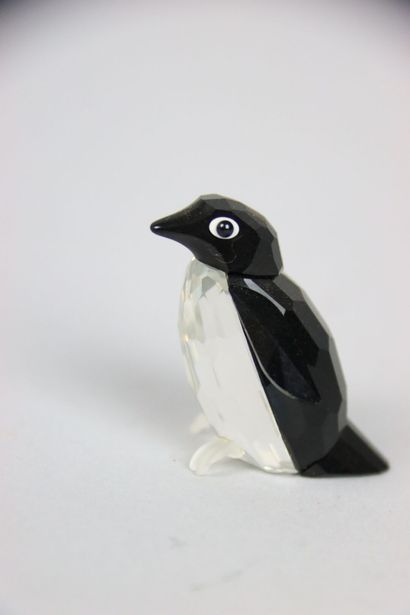 null SWAROVSKY. Crystal subject representing two penguins. Height: 6 cm and 4 cm