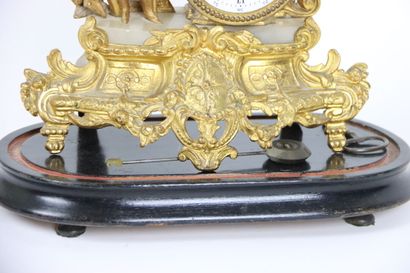 null Chased and gilt bronze clock with a farmer decoration and two brass and silvered...