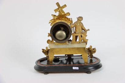 null Chased and gilt bronze clock with a farmer decoration and two brass and silvered...