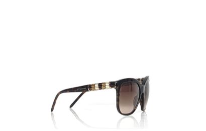 BULGARI Pair of SERPENTI sunglasses
Brown translucent pvc
Width: 14.5 cm
Length:...
