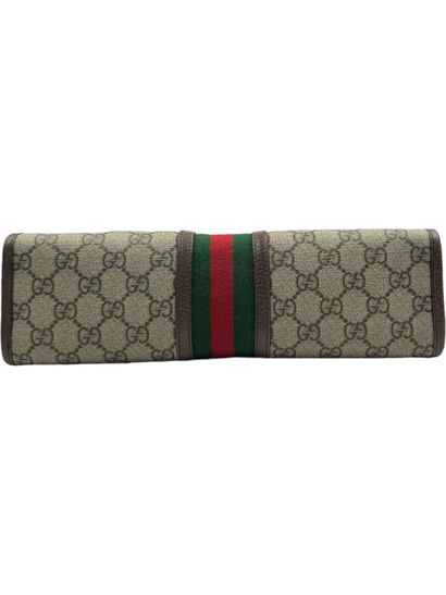GUCCI OPHIDIA toiletry bag
Toile GG Suprême beige, red and green cotton 
Silver-plated...