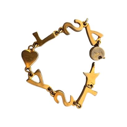 Yves SAINT LAURENT Mobile link bracelet with brand logo, circa 1990
Gilded metal
Signed...