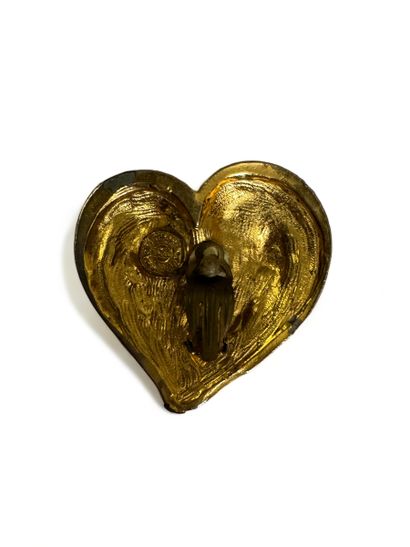 null Lot of costume jewelry including:

EDOUARD RAMBAUD Pair of heart-shaped ear...