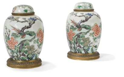 null A pair of enameled porcelain ovoid covered vases in the Green Family style,...