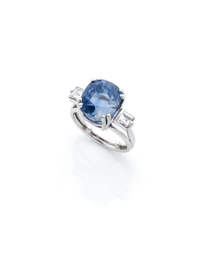 null Platinum 850 ‰ ring centered with a large cushion-shaped sapphire weighing 11.05...