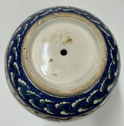 null Porcelain flared-neck vase enamelled in polychrome with Iznik decoration
Work...