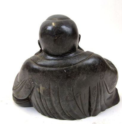 null Seated Buddha sculpture in hard stone
He holds a ball in his left hand, a symbol...