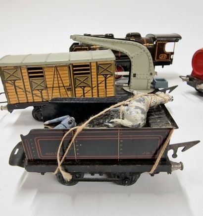 null A box of JEP model trains, including :
1 locomotive
6 wagons
1 drive
1 small...