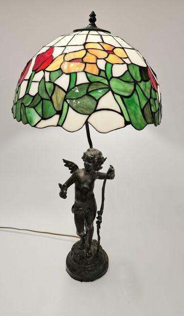 null TIFFANY (in the taste of) 
Table lamp
The base depicts a cherub 
Dark brown...