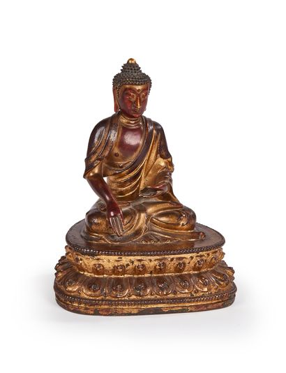 Statuette de bouddha en bronze laqué or....