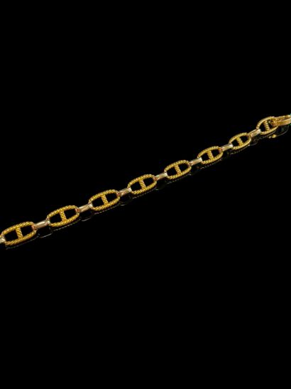 null 18K (750/1000 ‰) yellow and white gold navy link bracelet. 
Net weight: 10.44...