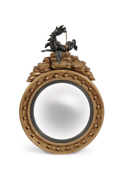 Miroir dit « sorcière » Circular "witch" mirror in molded, carved, gilded wood with...