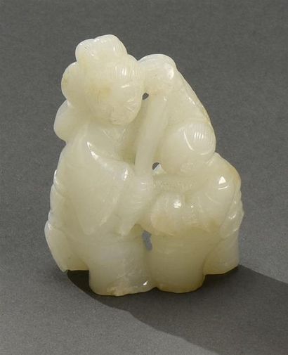 CHINE - XVIIIe siècle Groupe en jade blanc sculpté à sujet d'une femme et d'un
Karako
H....