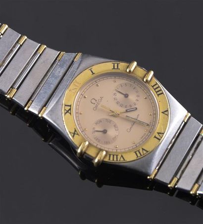 OMEGA Steel and gilded metal watch, "Constellation" model, gilded bezel adorned with...