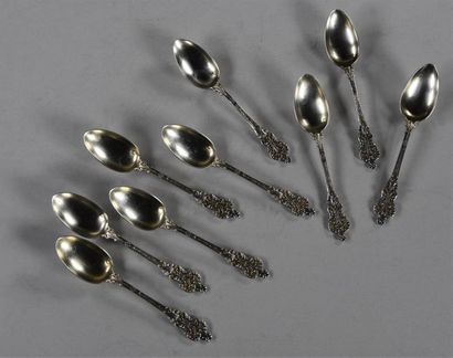 null Set of nine silver dessert spoons, the handle adorned with Renaissance style...