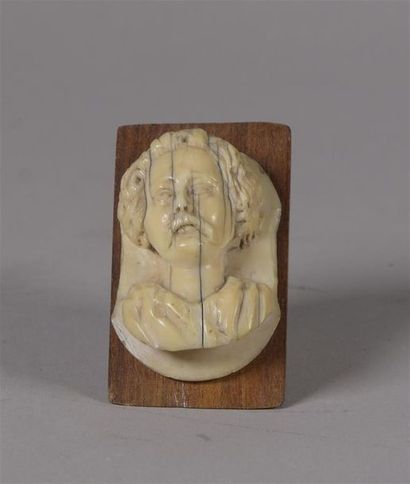 null Ivory carved with a bearded man's bust on a 17th century plaque On a modern...