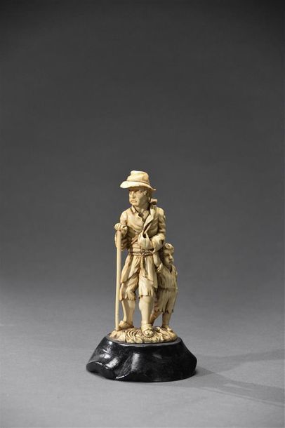 null Suite by Simon TROGER (1683-1768) Ivory group depicting a beggar and his child...