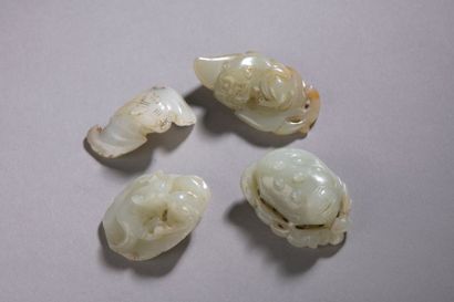 null CHINA - XIXth and XXth century Set including four nephrite pendants carved cat...
