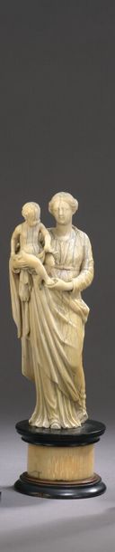 null CHILD'S VIRGIN in ivory carved in a round-bump on a blackened wood and ivory...