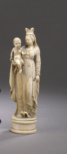null VIRGIN TO THE CHILD in ivory carved in a round hump crushing the snake of his...