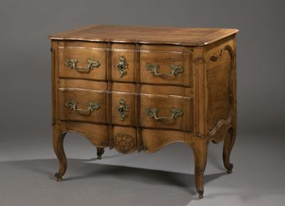 null Moulded and carved fruitwood COMMODE, the crossbow front opening with two drawers,...