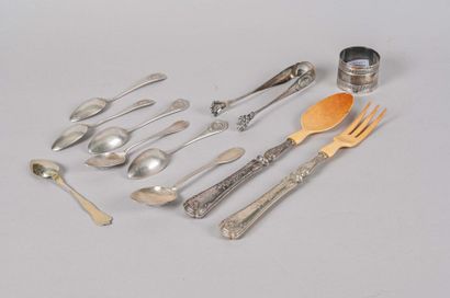 null Silver lot including : - a silver sugar tongs with monogrammed blind cartridges...