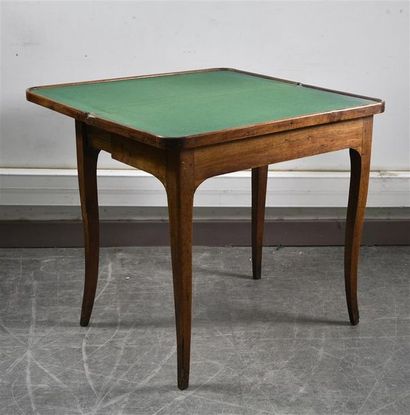 null Walnut game table, the top inlaid with a checkerboard and flowers in oval medallions,...