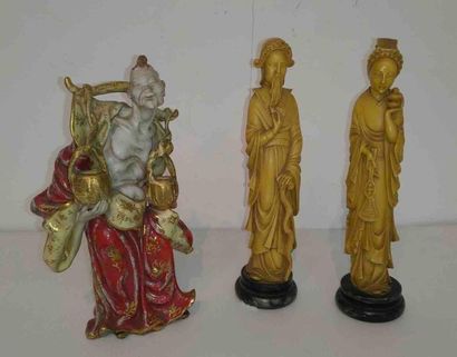 null CHINA Set of three statuettes: the first in ceramic, the other two in resin,...