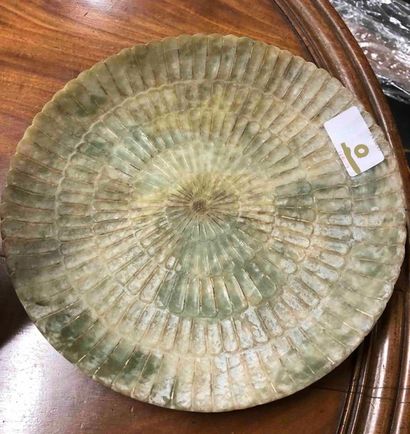 null CHINA Carved celadon nephrite plate with radiating decoration of gadrooned petals....