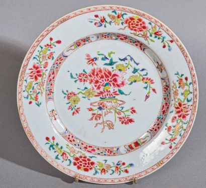 null CHINA Pair of porcelain plates in rose family enamels with peony decoration...