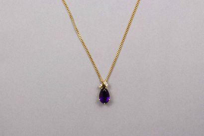 null 18k (750 thousandths) yellow gold pendant set with a pear-shaped amethyst and...
