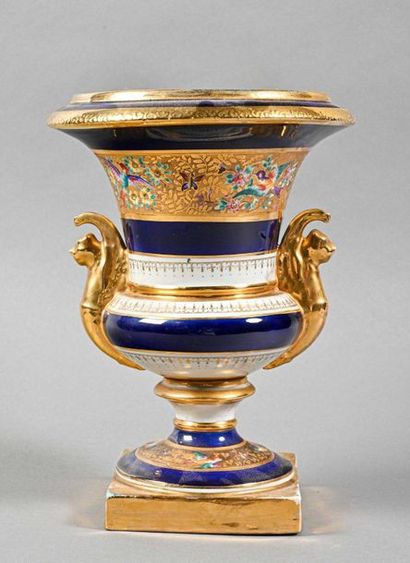 null PARIS Medici porcelain

vase with large blue background, golden handles and...
