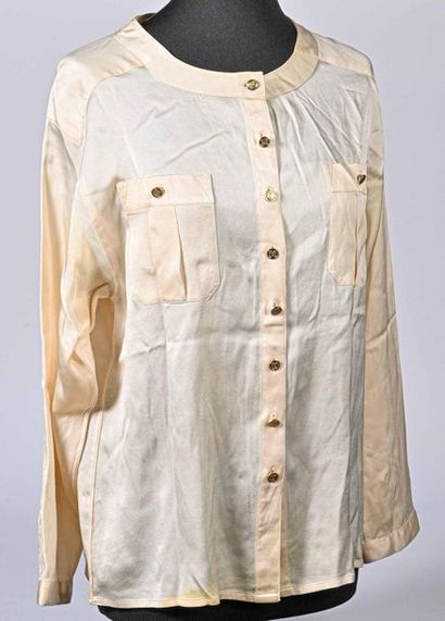 CHANEL. Ivory silk satin blouse, round neckline, single-breasted, long sleeves, two...