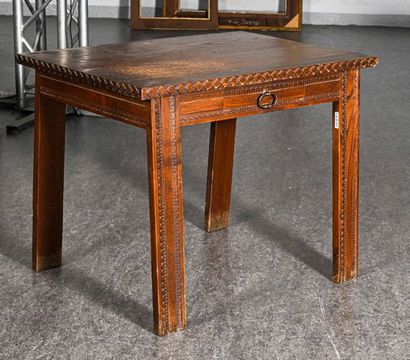 Petite table In natural wood carved with geometrical patterns, a drawer

Breton work,...