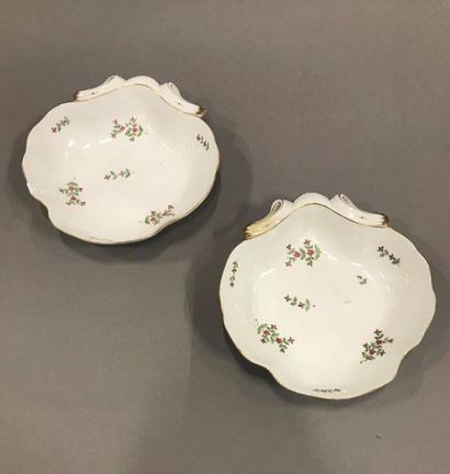null "Pair of porcelain shell bowls with floral design, gold threads. One rough....
