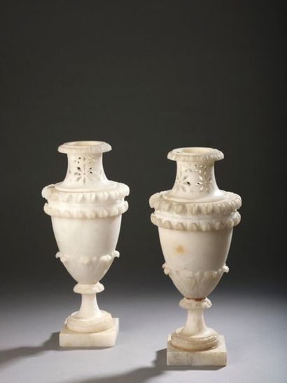 null "Pair of openwork alabaster baluster-shaped vases carved with foliage. Pedestal...