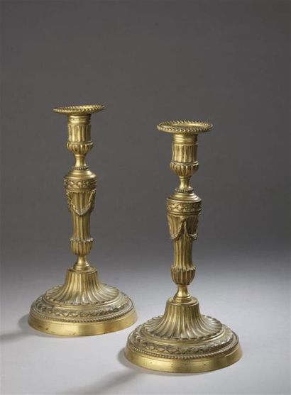 null "Pair of gilt bronze torches, was baluster with flutes and gadroons decorated...