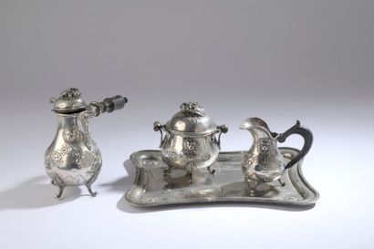 null Silver coffee service decorated in repoussé with lion mufles and garlands of...
