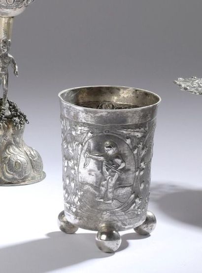 null Timbale in silver resting on three ball feet decorated in repoussé with medallions...