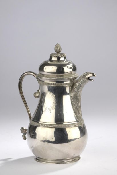 null A baluster-shaped silver pot, highlighted with water leaf mouldings and engraved...