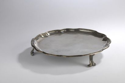null Round presentation tray in plain silver model nets contours resting on three...