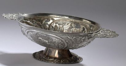null Oval silver bowl resting on a pedestal with openwork handles decorated with...