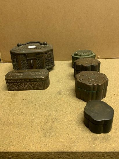 null Six bronze betel boxes in octagonal, oblong or circular contoured shape. One...