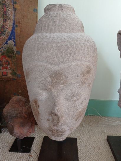 null THAILAND - 15th century

Head of Buddha in grey sandstone, the headdress surmounted...
