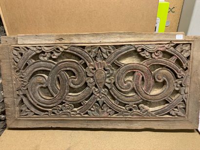 null Decorative panel in carved and openwork wood with scroll motifs. Trace of polychromy.

India,...