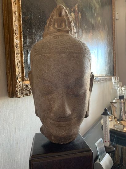 null Khmer styleGrey sandstone Lokeshvara head, eyes closed, conical headdress with...